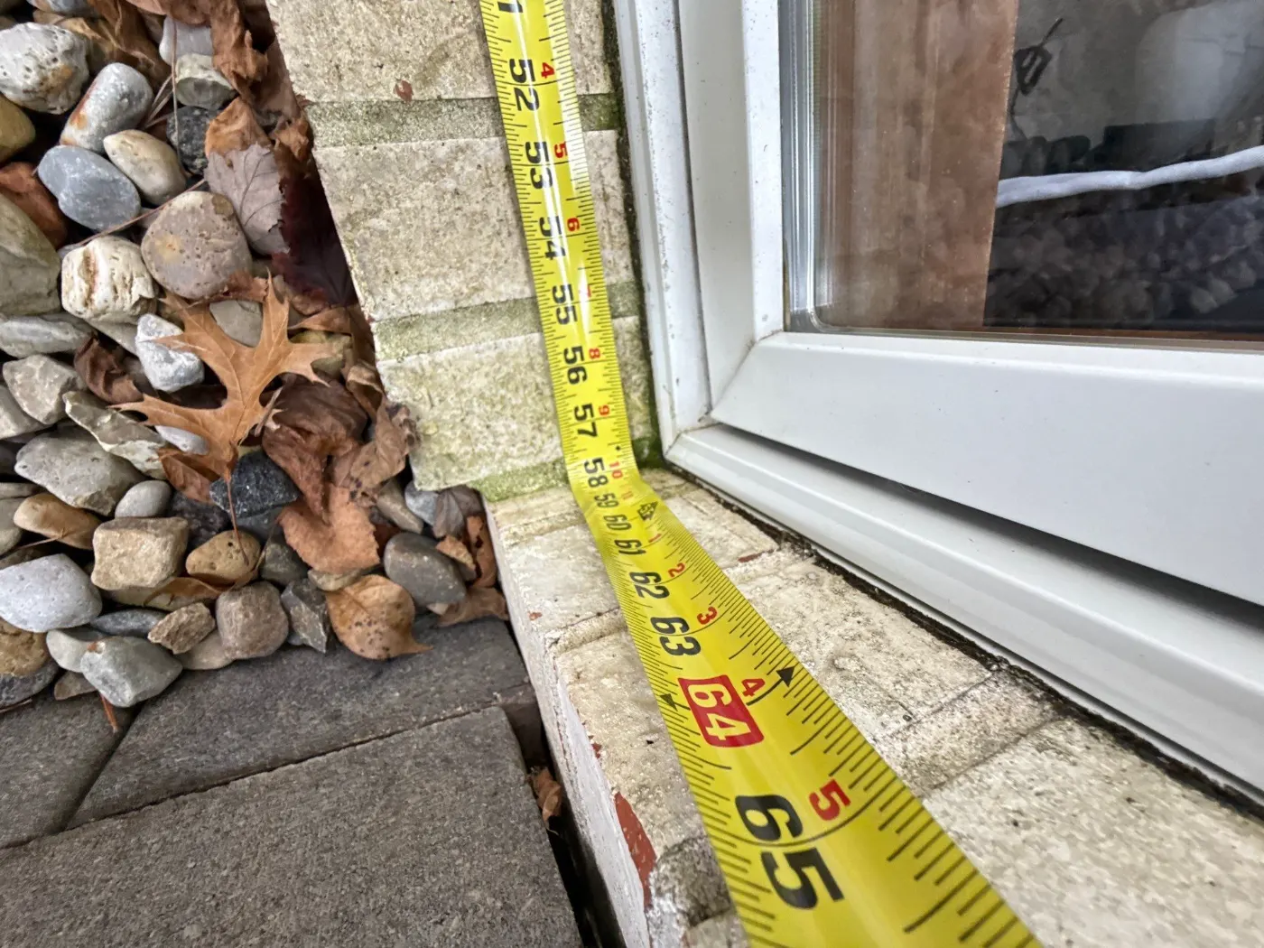 Storm-damaged window documented in Stones Crossing